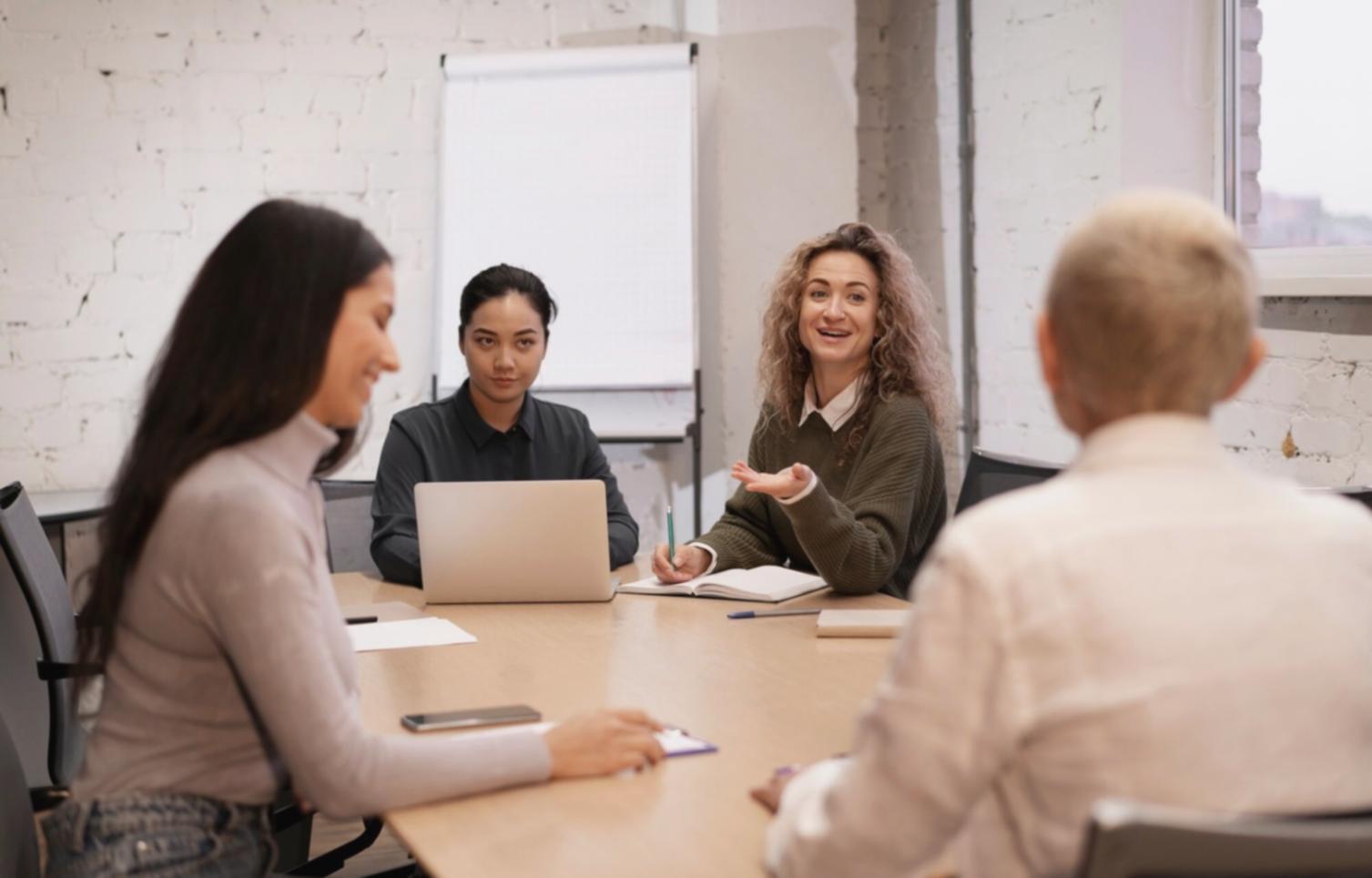 Professional analyzing financial charts and investment data on multiple monitors